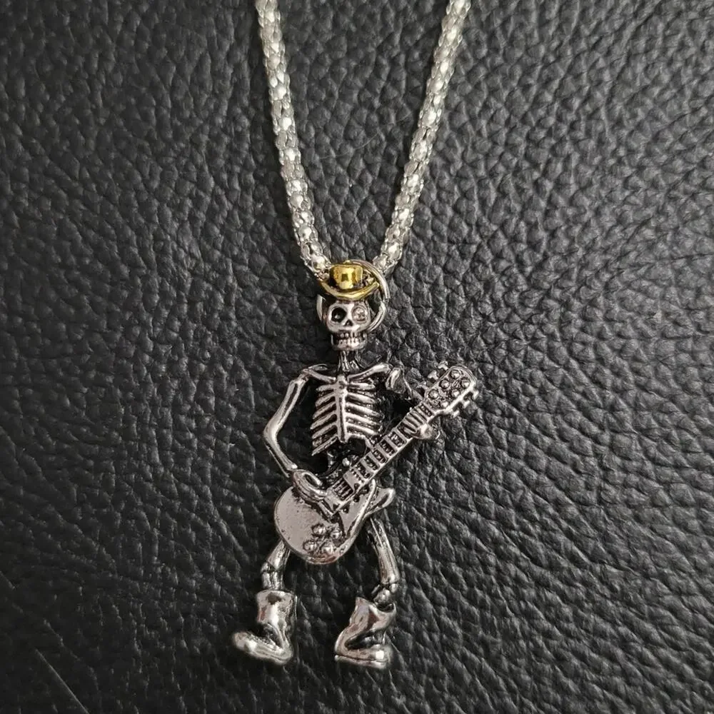 Skeleton playing guitar necklace wearing hat and boots